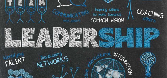 Notes on a blackboard the word "leadership" is highlighted in the center; other terms on the blackboard include: "coaching others", "identifying talent" or "building consensus" some of those terms are held by stick figures or accompanied by symbols like light bulbs or a globe